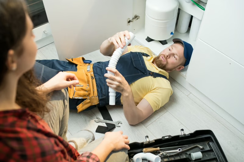 Licensed plumber inspecting pipework and plumbing faults in Capalaba home