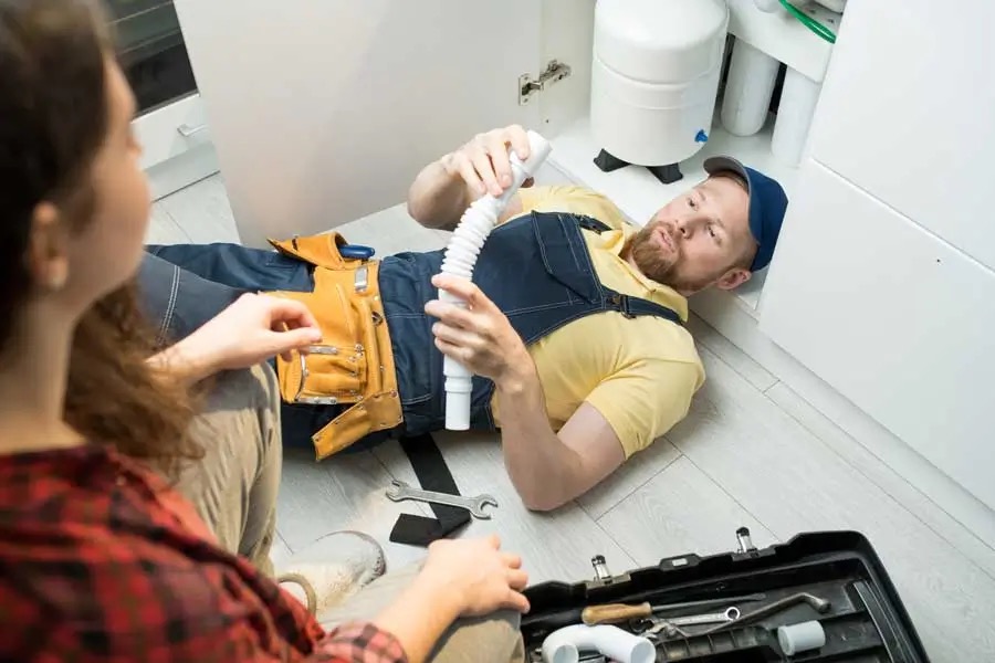 Licensed plumber inspecting pipework and plumbing faults